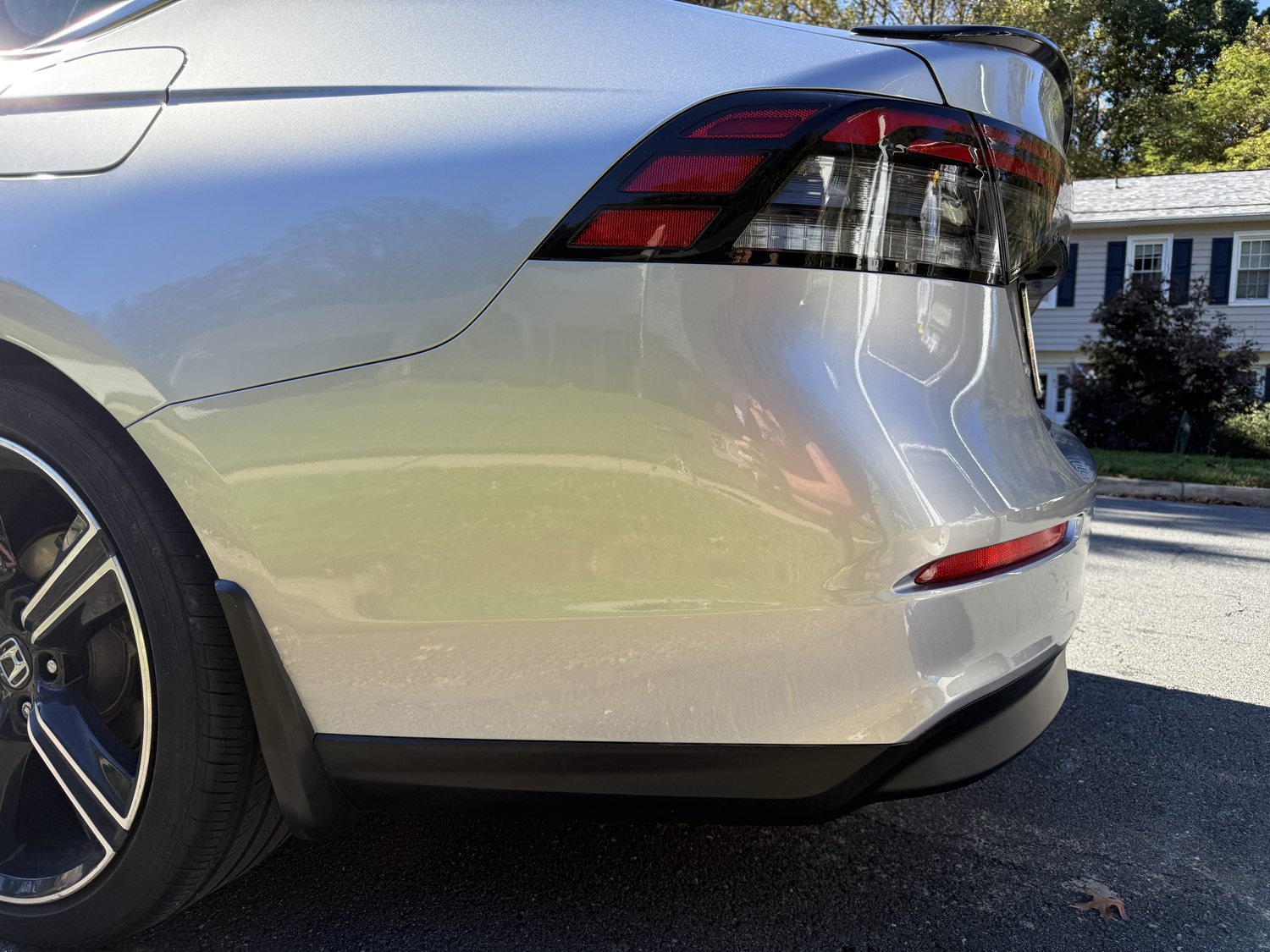 Same silver Accord rear bumper uncovered after paintwork