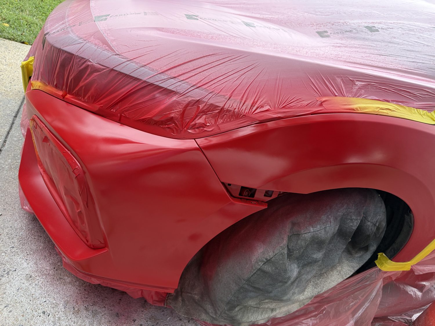 Red Civic front corner masked during paintwork