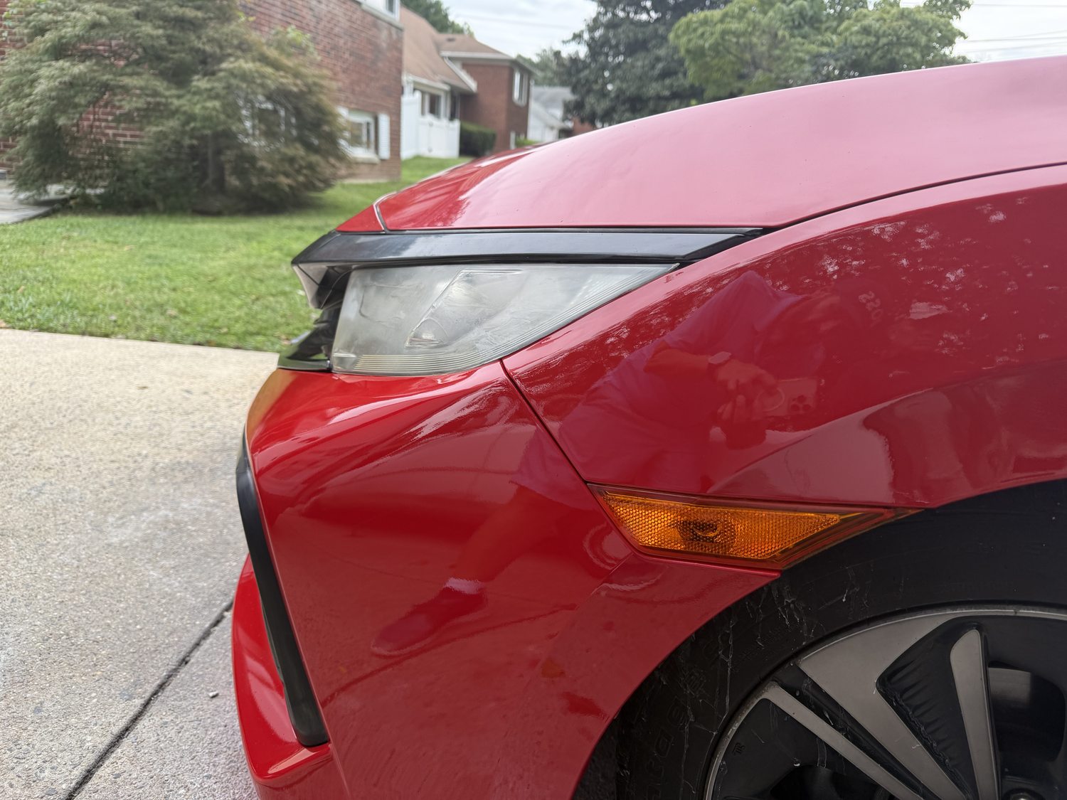 Red Civic front corner uncovered after repair